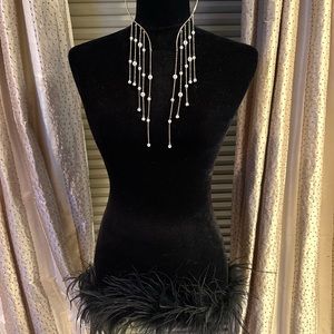 necklace- Hangs in the front with pearls. Silver and pearls